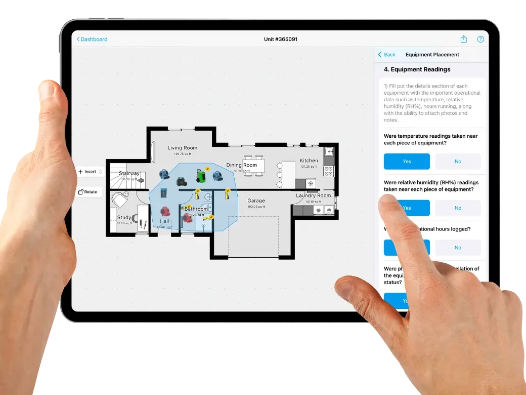 What Happens During a Professional Property Damage Assessment? A contractor reviewing damage documentation on a laptop during a property assessment