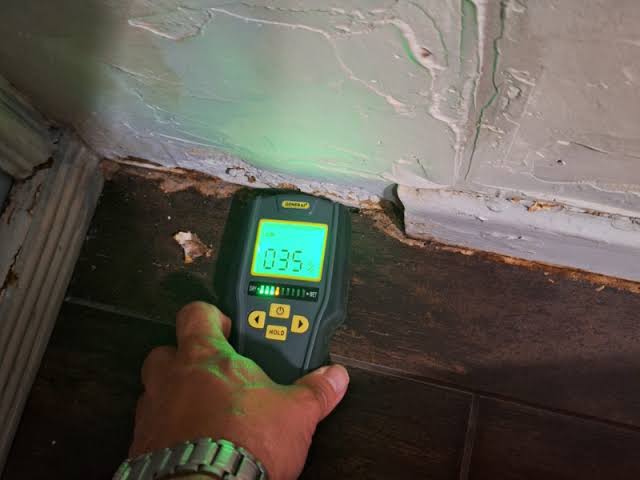 How Long Does Property Restoration Typically Take? Restoration technician using moisture meter to identify full scope of damage at Freeport, FL property