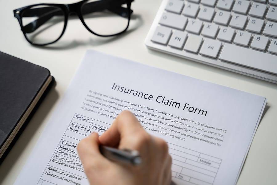 The Hidden Costs of Delaying Water Damage Repairs Restoration professional documenting water damage for insurance claim at Freeport, FL property